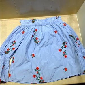 A light blue top with red flowers